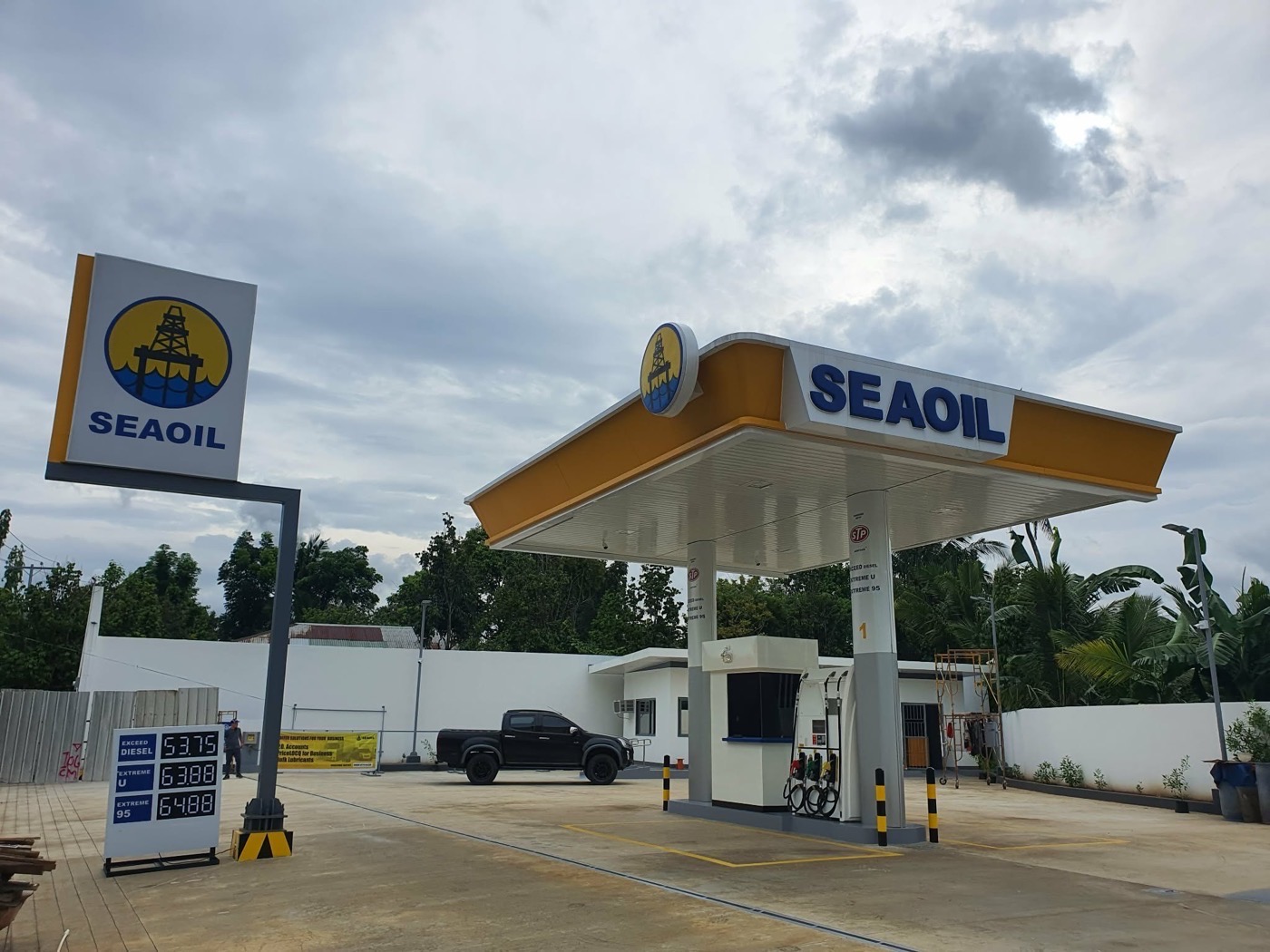 Completed SEAOIL service station in Santa Maria, Laguna: the pylon price sign beside a finished canopy and dispenser island.