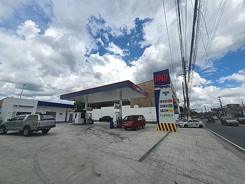 Completed station from across the road, showing the canopy, pumps and roadside price pylon.
